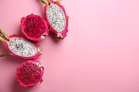 Tasty cut dragon fruits on color backgroundの写真素材