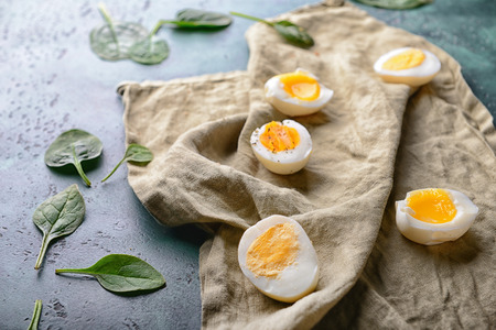 Halves of boiled eggs on napkin