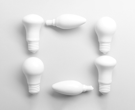 Frame made of light bulbs on white backgroundの写真素材