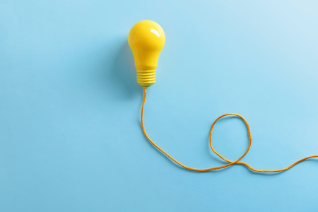 Painted light bulb on color backgroundの写真素材