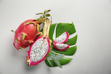 Tasty dragon fruits on light backgroundの写真素材