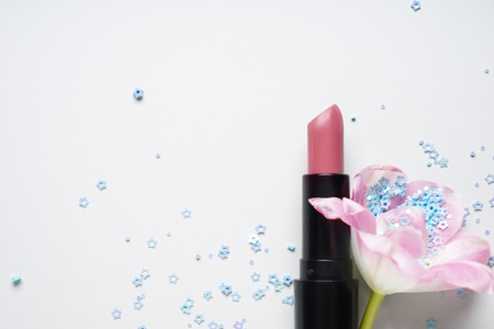 Color lipstick with flower on white backgroundの写真素材