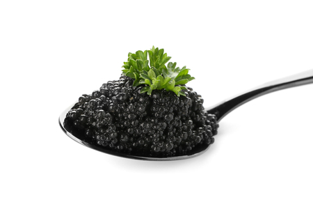 Spoon with delicious black caviar on white backgroundの写真素材