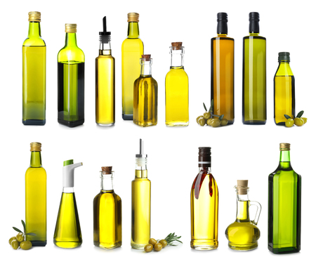 Different bottles with olive oil on white backgroundの写真素材