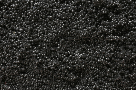 Delicious black caviar, closeup