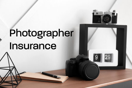 Stylish workplace of modern photographer. Concept of insuranceの写真素材