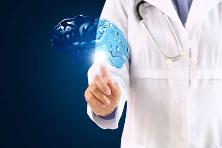 Female neurologist with digital model of brain on dark background