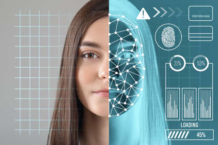 Young businesswoman using facial recognition system for data protectionの写真素材