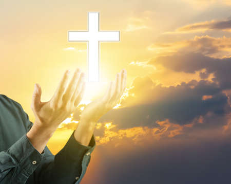 Religious man praying outdoors against cloudy skyの写真素材