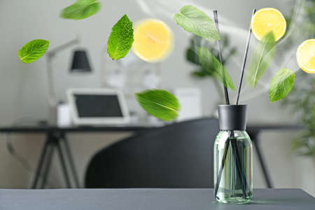 Reed diffuser on table in roomの写真素材