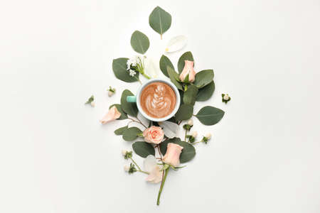 Beautiful composition with cup of tasty cappuccino on white backgroundの写真素材