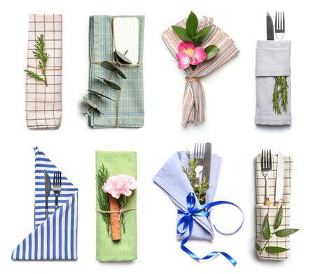 Set of different table settings on white backgroundの写真素材