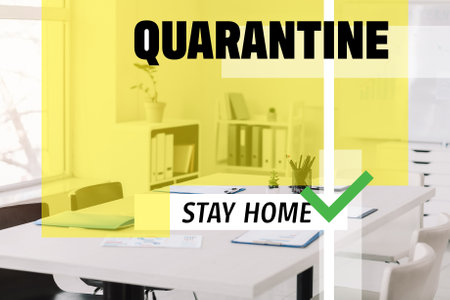 Empty office with text QUARANTINE, STAY HOME. Concept of Coronavirus epidemicの写真素材
