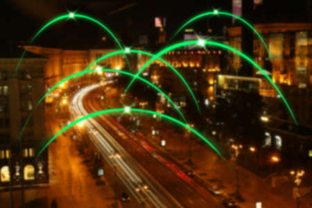 View of modern city with location pointers at nightの写真素材