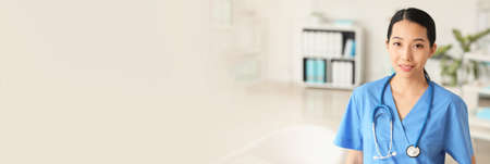 Female Asian doctor in clinicの写真素材