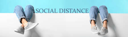 Legs of men on color background. Concept of social distanceの写真素材