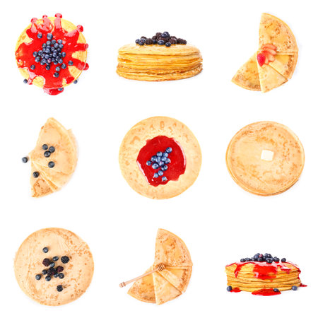 Set of tasty blini with berries on white backgroundの写真素材