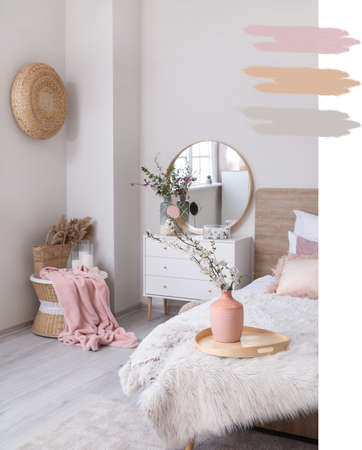 Interior of beautiful modern bedroom with spring flowers. Different color patternsの写真素材