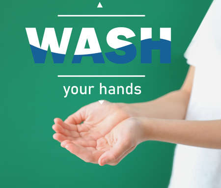 Young woman and text WASH YOUR HANDS on color backgroundの写真素材
