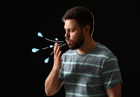 Coughing man on dark background. Concept of epidemic