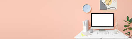 Modern workplace with computer in room with space for textの写真素材