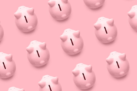 Many piggy banks on color backgroundの写真素材