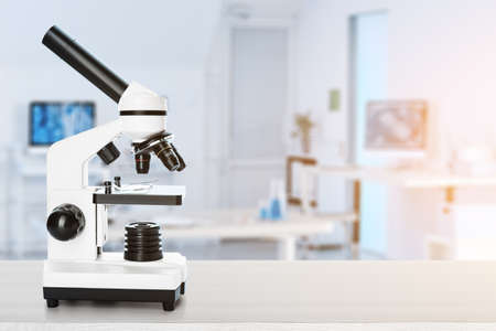 Modern microscope on table in scientific laboratoryの写真素材