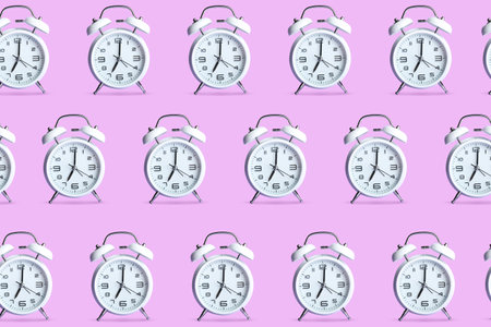 Many alarm clocks on color backgroundの写真素材