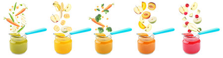 Many jars with healthy baby food and falling ingredients on white backgroundの写真素材