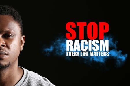 Sad African-American man on dark background with text STOP RACISM, EVERY LIFE MATTERSの写真素材