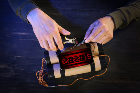 Man defusing bomb at table