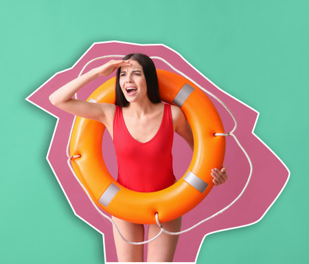 Beach rescuer with lifebuoy on color backgroundの写真素材