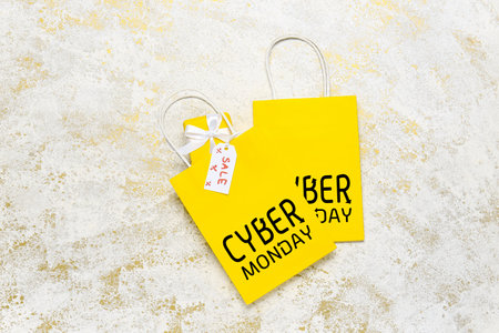 Paper shopping bags with text CYBER MONDAY on light backgroundの写真素材