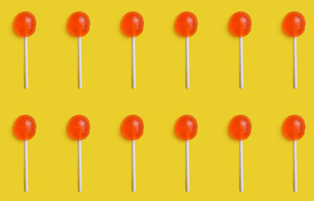 Tasty lollipops on color background