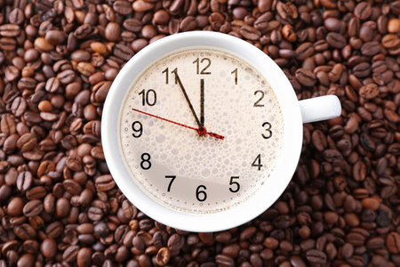 Cup with clock on coffee beans