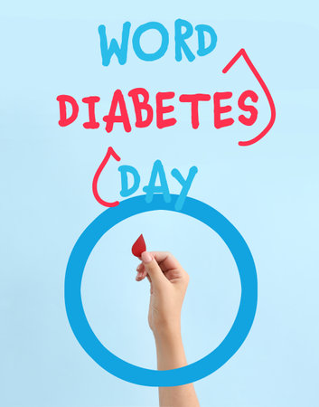 Female hand with blood drop and text WORLD DIABETES DAY on color backgroundの写真素材