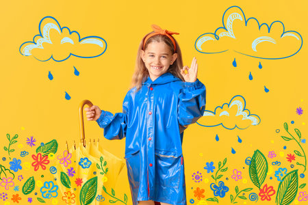 Cute little girl in raincoat and with umbrella on color background with drawn clouds and flowersの写真素材