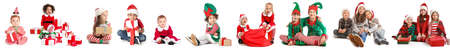 Happy little children with Christmas gifts on white backgroundの写真素材