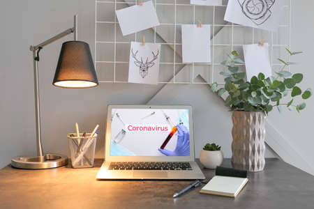 Laptop on table in room. Concept of medical consultation during coronavirus epidemic