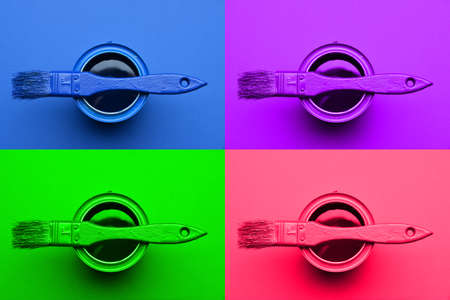 Cans of paint and brushes on color background, top view