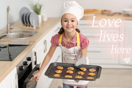 Little housewife with tasty cookies in kitchenの写真素材