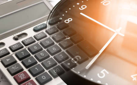 Double exposure of clock and calculator. Time is moneyの写真素材