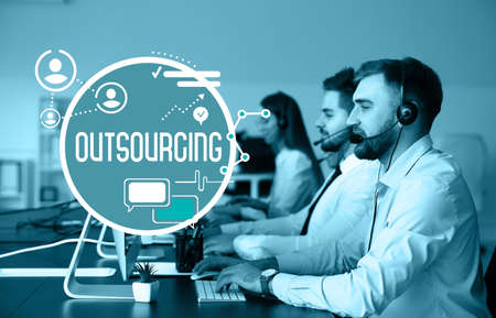 Team of technical support agents working in office. Concept of outsourcing