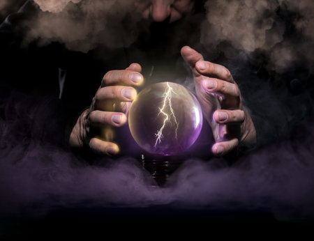 Fortune teller with crystal ball on dark background, closeupの写真素材