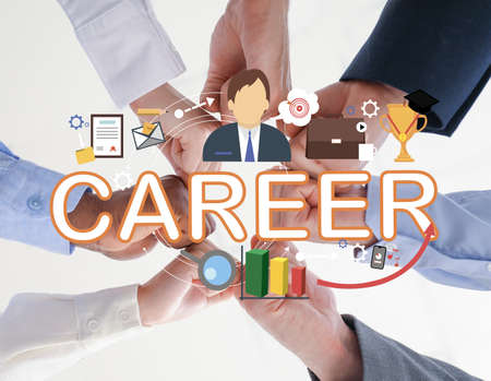 Group of business people putting hands together in office, bottom view. Concept of career growthの写真素材