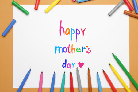 Text HAPPY MOTHER'S DAY on paper sheet with felt-tip pens on color backgroundの写真素材