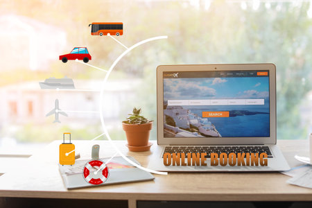Open page of online booking service on screen of laptop on tableの写真素材