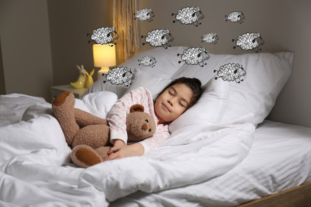 Cute little Asian girl sleeping in bedの写真素材