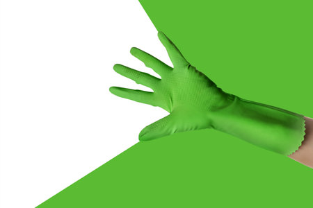 Hand in rubber glove on color background with place for textの写真素材