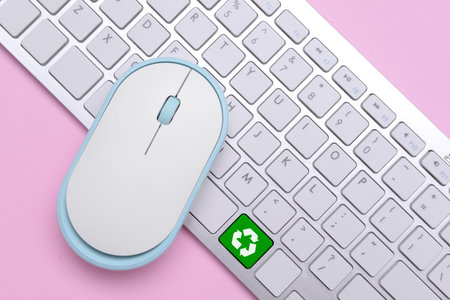 Modern computer mouse and keyboard on color background. Ecology conceptの写真素材